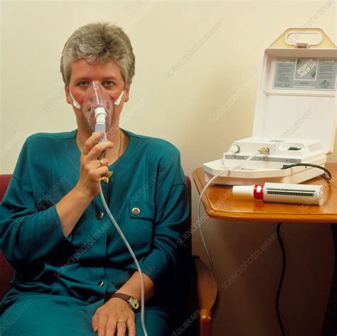 Asthma sufferer using nebulizer - Stock Image - M109/0028 - Science Photo Library