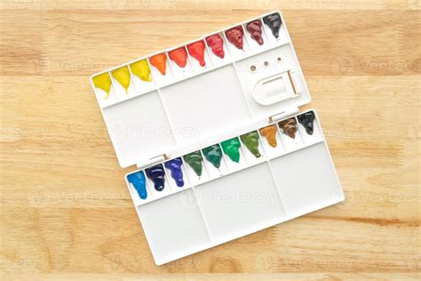 Watercolor paints set. Color in watercolor palette with wooden ...