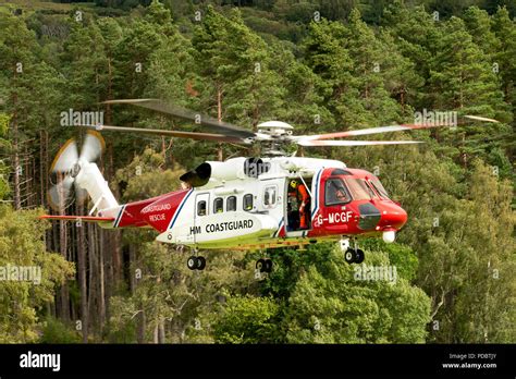 Hm coastguard helicopter hovering hi-res stock photography and images - Alamy