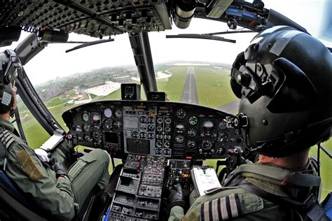 The crew of a Royal Air Force Griffin helicopter of the Defence Helicopter Flying School ...