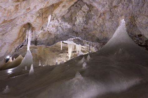 Stalagmites sticking out of the ice floor of Dobšinska Ice Cave ...