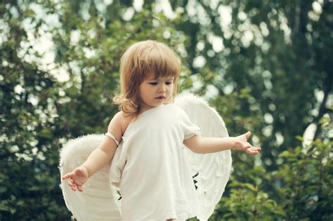 Premium Photo | Small boy in angel wings