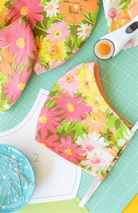 sewing supplies laid out on top of a piece of paper with scissors and ...