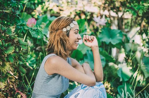 "Young Woman Laughing In Garden" by Stocksy Contributor "Dominique Chapman" - Stocksy