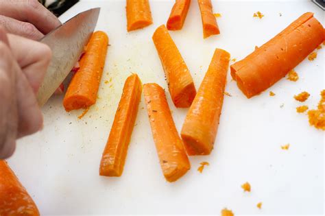 Man cutting carrot batons - Free Stock Image