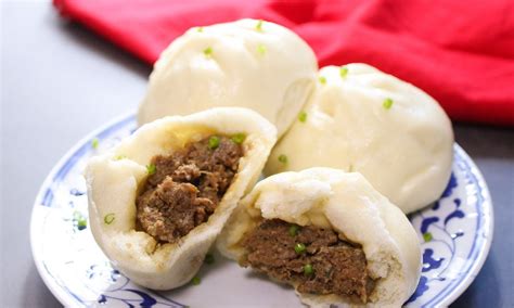 Chinese steamed pork buns served on a plate as part of a dim sum style lunch | Steamed pork buns ...