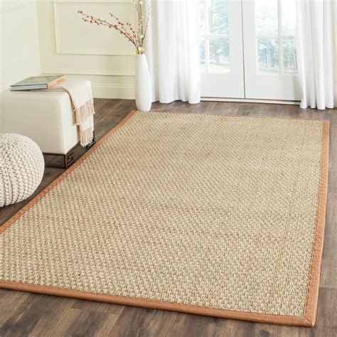 a large rug in the middle of a room with white curtains and wooden flooring