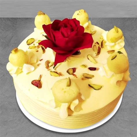 Send ras malai cake with rose on top online by GiftJaipur in Rajasthan