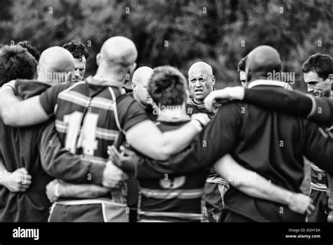 Rugby players huddle after a victorious match Stock Photo - Alamy