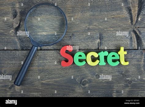 Secret word on wooden table Stock Photo - Alamy