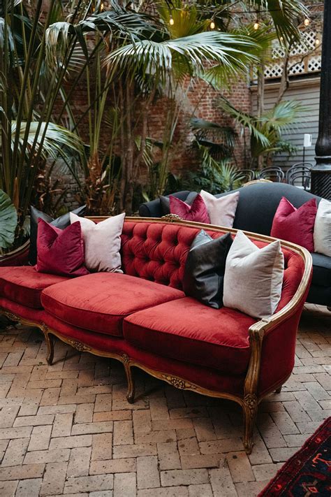 Red Velvet Sofa With White, Black and Red Pillows, Vintage Vibes