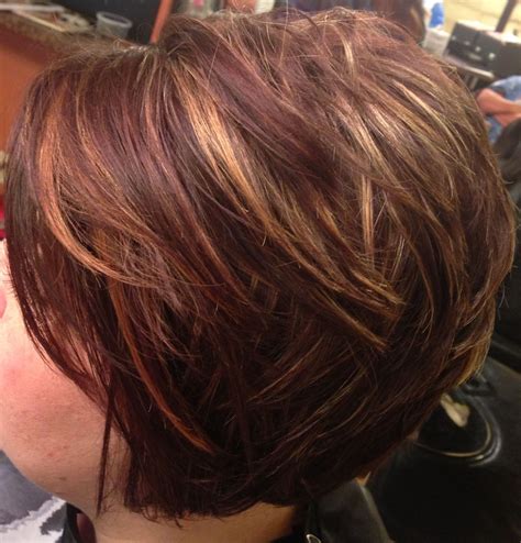 Asymmetrical, inverted bob, caramel highlights. Short hair.....I had this for awhile and loved ...