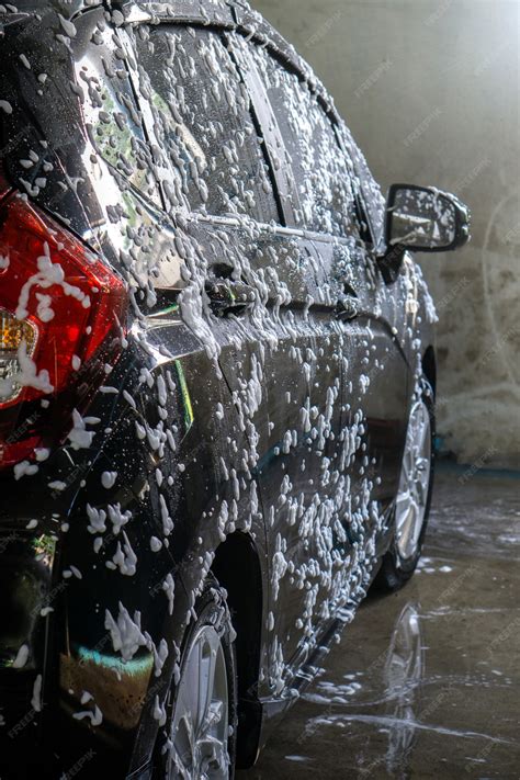 Premium Photo | Selective focus of Black Car wash with soap