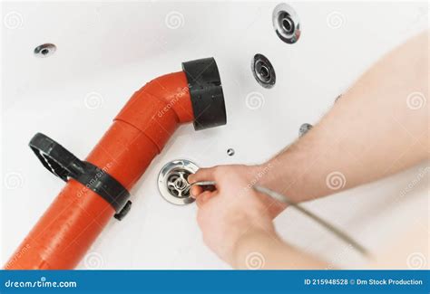 Plumber using drain snake stock photo. Image of cable - 215948528