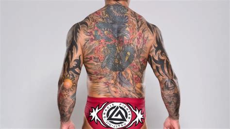 Batista's Tattoos (Back View) | Unique tattoo designs, Tattoo designs ...