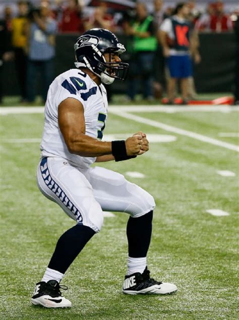 Russell Wilson #3 of the Seattle Seahawks celebrates a fourth quarter touchdown against the ...