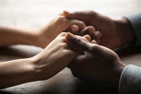 Mixed,Ethnicity,Family,Couple,Holding,Hands,On,Table,,Black,Man | The Optimist Daily: Making ...