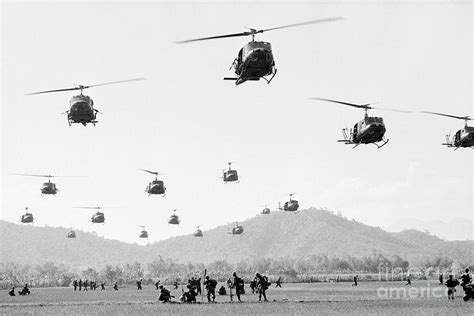 Helicopters Landing In Vietnam by Bettmann