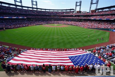 Photo: Large American Flag Held By Volunteers In Center Field ...