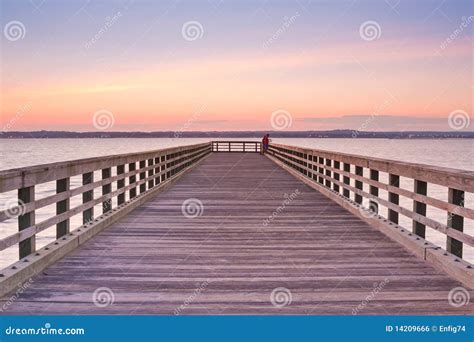 Wooden Pier at sunset stock photo. Image of lines, beach - 14209666