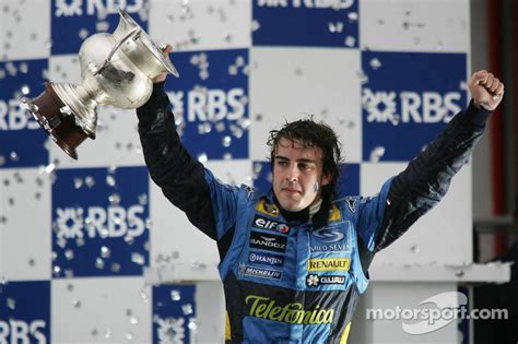 Podium: 2005 World Champion Fernando Alonso celebrates at Brazilian GP