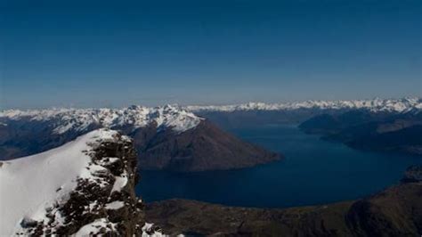 Fly over of The Remarkables mountain range peak in Queenstown