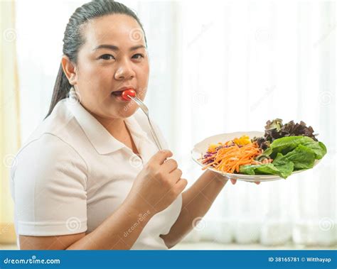 Fat woman eating salad stock image. Image of vegetarian - 38165781