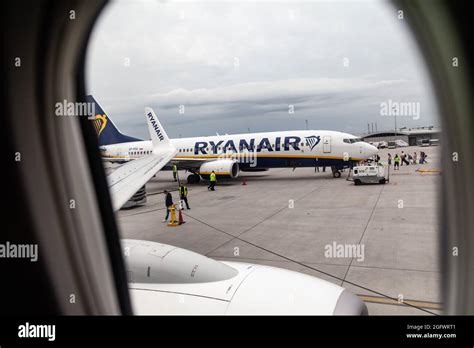 Ryanair Airlines Airbus A320 on the landing area seen through the airplane's window. Krakow John ...