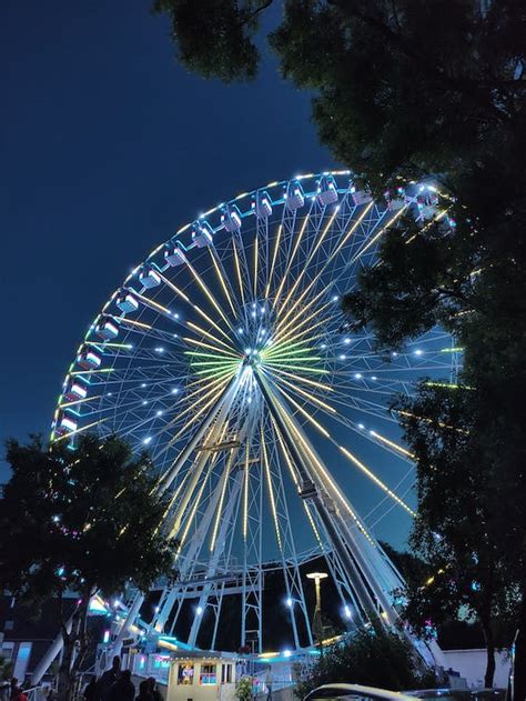 A Ferris Wheel Illuminated at Night · Free Stock Photo