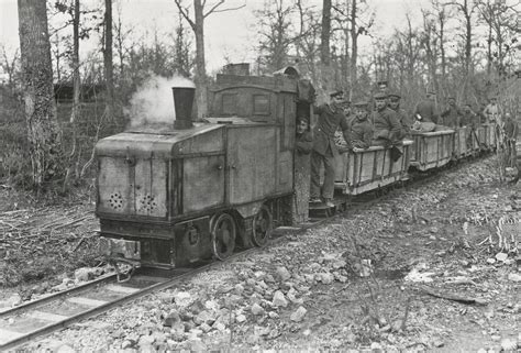 German narrow gauge steam locomotive making a troop run directly behind the Western Front in the ...