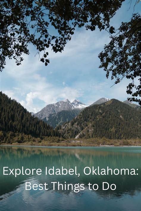 a lake with mountains in the background and text that reads explore label, oklahoma best things ...