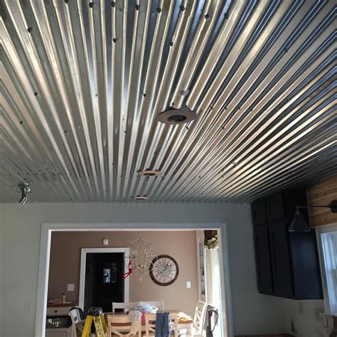 Our corrugated tin ceiling that my husband installed...it hides the ugly swirl pattern that was ...