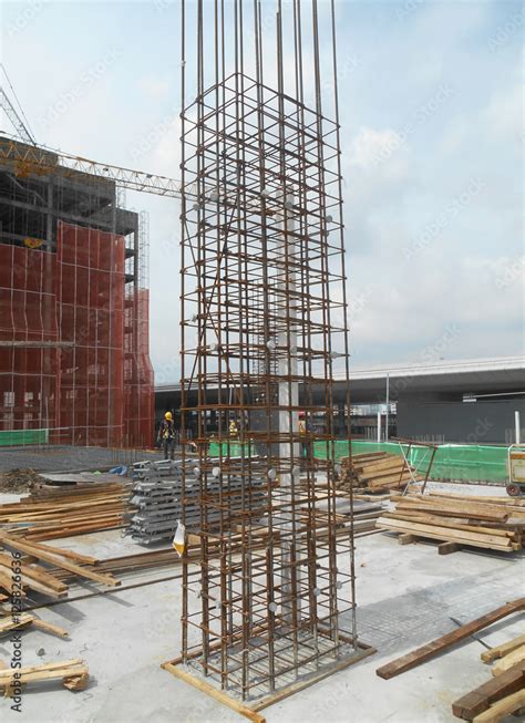 Concrete column reinforcement bar at the construction site fabricated by workers.It will be ...