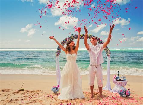 Bride and groom during the wedding on the beach in Bali