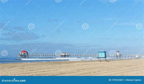 The Huntington Beach Pier with Surfers in the Water Stock Image - Image ...