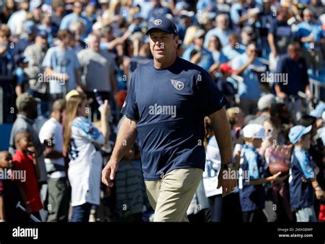 Tennessee Titans head coach Mike Mularkey watches players warm up ...