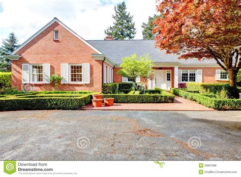 Red Brick House White Shutters