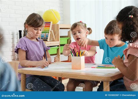 Adorable Children Drawing Together at Table. Kindergarten Playtime Activities Stock Image ...