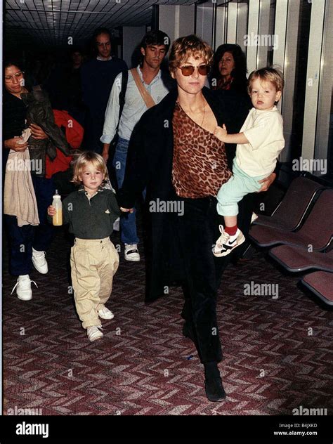 Tatum O Neal wife of Tennis star John McEnroe with her children Kevin and Sean at Heathrow ...