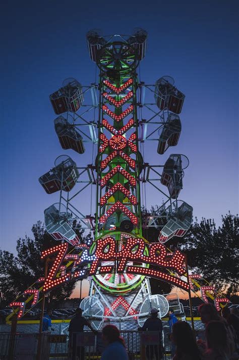 Carousel in an Amusement Park at Dusk · Free Stock Photo