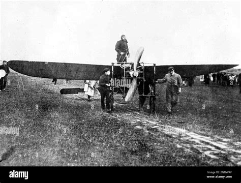 French aviator Louis Bleriot, standing in his plane, in France, as it wheeled into position ...