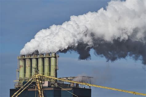 Free Photo | Smoke coming out of factories in an industrial area