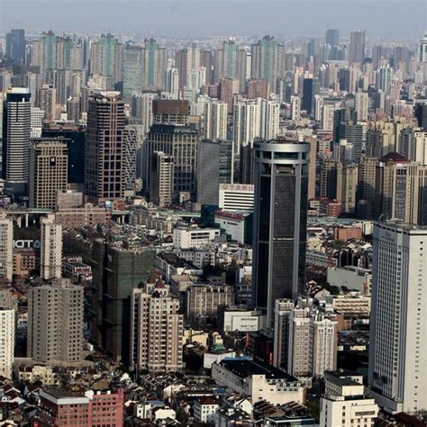 Shanghai caps population at 25 million to rein in booming housing market amid limited land ...