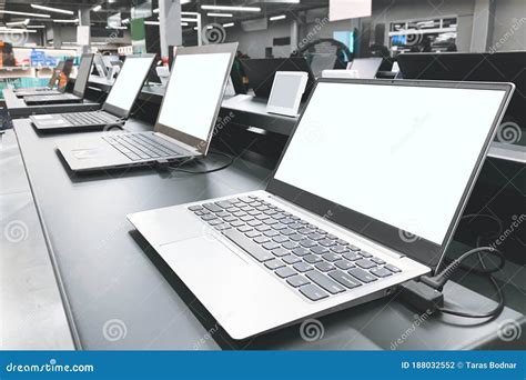 Department of Laptops in the Electronics Store. Table Showcase with ...