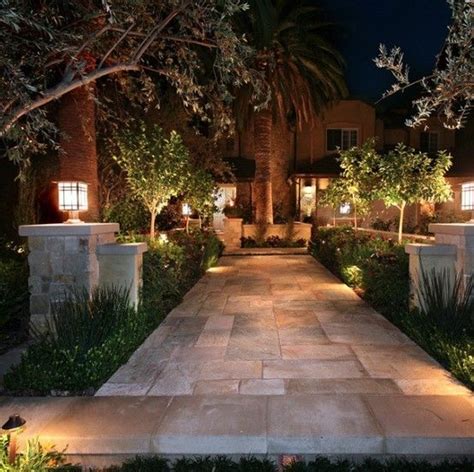 An intricate stone walkway light up beautiful with simple outdoor ...