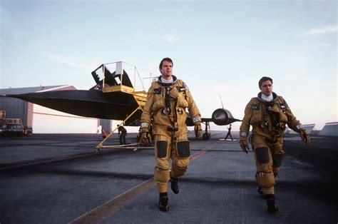 The crew of an SR-71A aircraft (background) walks away from the flight line upon arrival : r ...