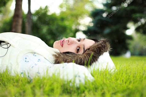 Beautiful girl lying down of grass — Stock Photo © jazzikov #1265064