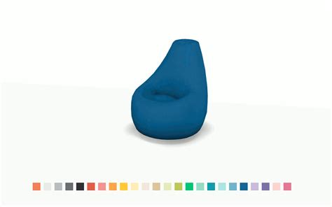 a blue bean bag chair sitting on top of a white table next to color ...
