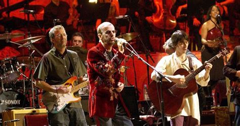 Eric Clapton, Ringo Starr, and Dhani Harrison performing during the ...