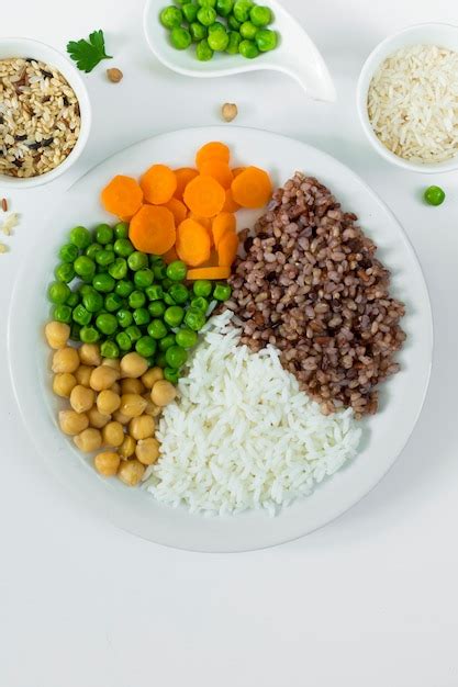 Free Photo | Different types of porridge with vegetables on big plate with rice bowls